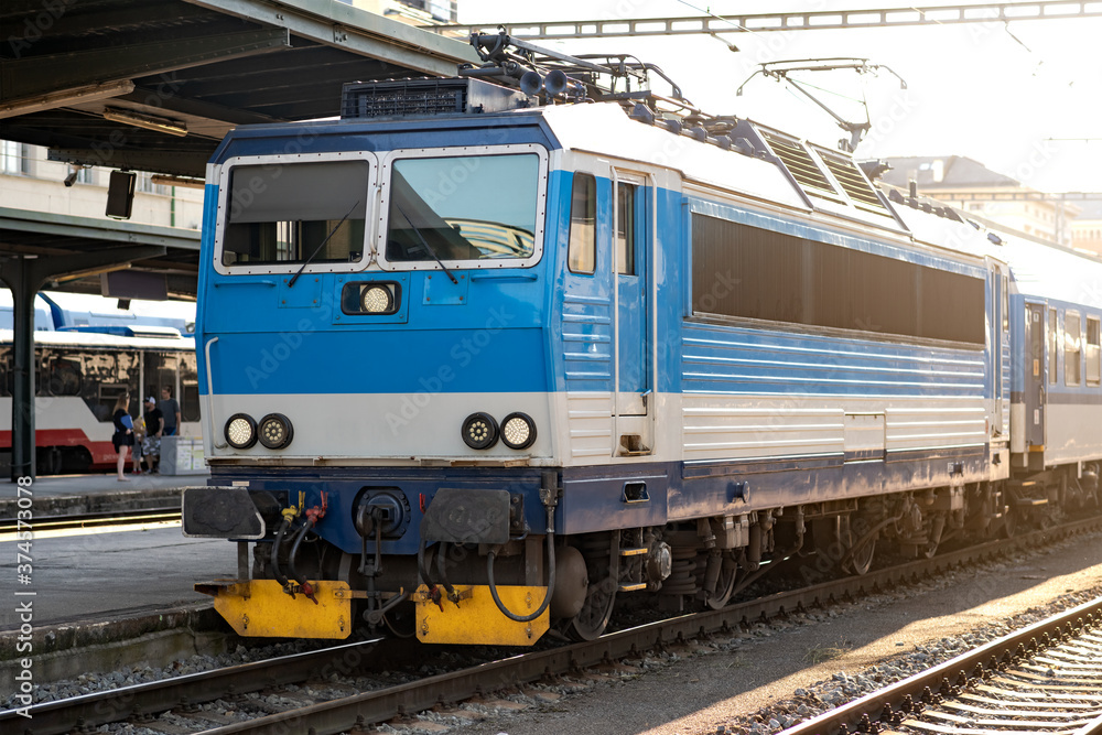 Passenger Train Waiting on the Platform of the Main Station, Electric Locomotive on an European Railway, Efficient Travel by Rail