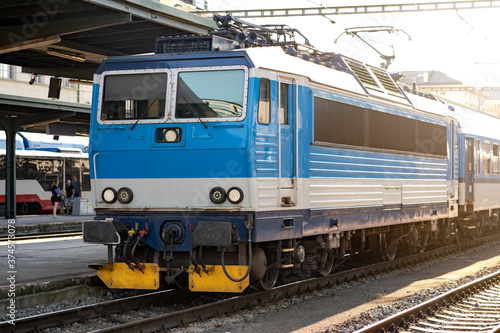 Passenger Train Waiting on the Platform of the Main Station, Electric Locomotive on an European Railway, Efficient Travel by Rail