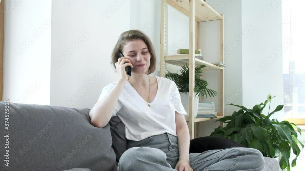 young pretty woman makes phone call, gets shocking news, does not know what to do, feels stress, hopelessness, tries to restrain herself, cries. sorrow, grief, misery, desperation, depression, shock young pretty woman makes phone call, gets shocking news, does not know what to do, feels stress, hopelessness, tries to restrain herself, cries. sorrow, grief, misery, desperation, depression, shock