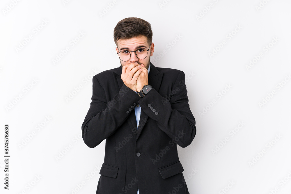 Young caucasian business man posing in a white background isolated Young caucasian business man shocked covering mouth with hands. Young caucasian business man posing in a white background isolated Young caucasian business man shocked covering mouth with hands.
