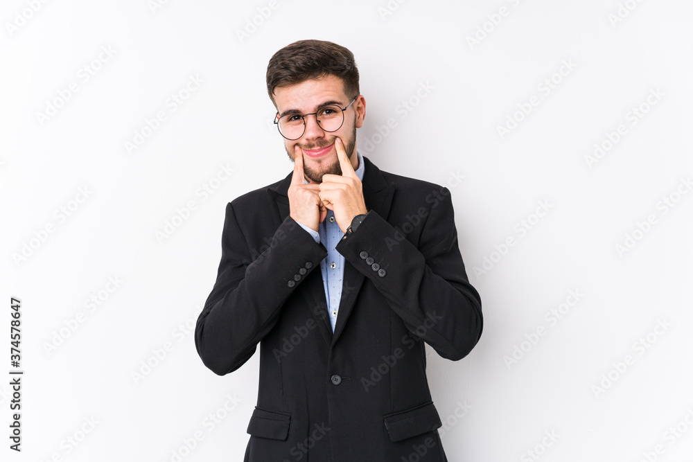 Young caucasian business man posing in a white background isolated Young caucasian business man doubting between two options. Young caucasian business man posing in a white background isolated Young caucasian business man doubting between two options.