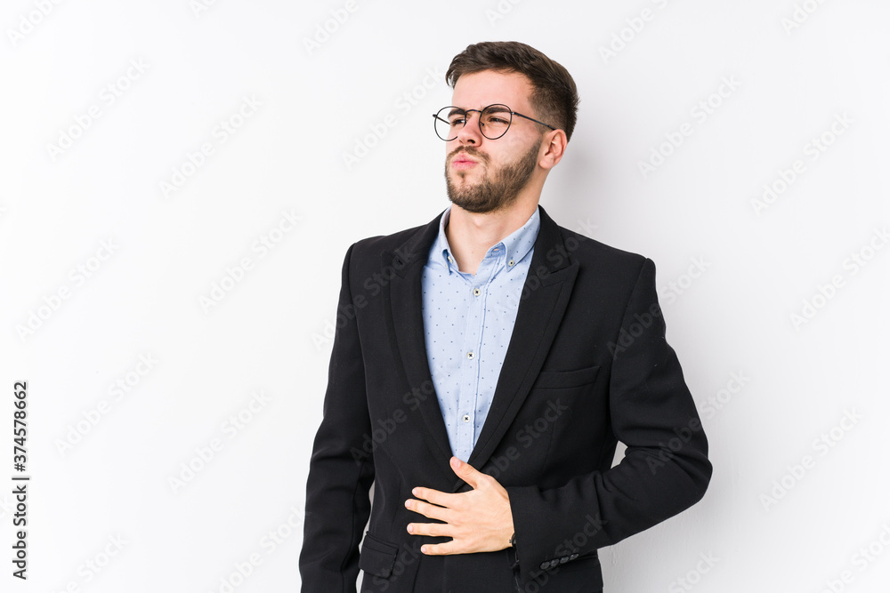 Young caucasian business man posing in a white background isolated Young caucasian business man touches tummy, smiles gently, eating and satisfaction concept. Young caucasian business man posing in a white background isolated Young caucasian business man touches tummy, smiles gently, eating and satisfaction concept.
