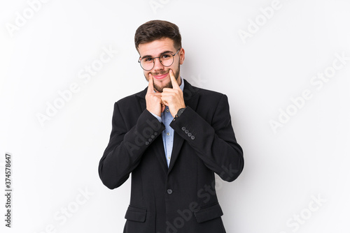 Young caucasian business man posing in a white background isolated Young caucasian business man doubting between two options.