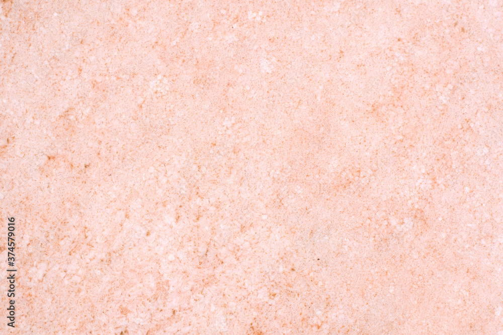 Fototapeta premium Salt crystals at the bottom of a pink salt lake. The texture of the bottom of a salt lake in Crimea. Focusing on the center of the frame.