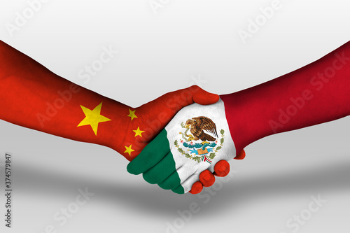 Photography Handshake between mexico and china flags painted on hands, illustration with clipping path