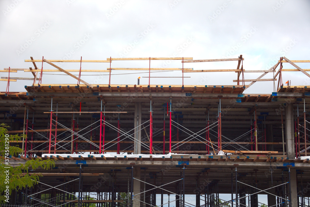 building under construction residential development metal beams structure