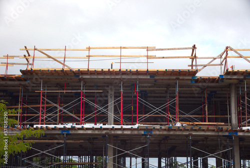 building under construction residential development metal beams structure