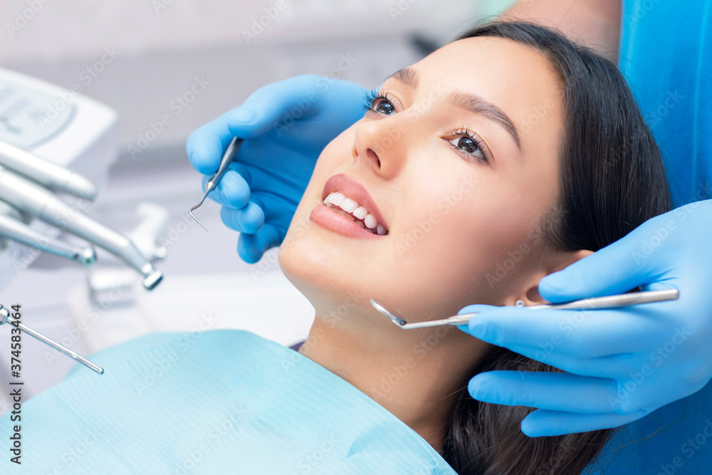 dentist examines the patients teeth at the dentist. dentist examines the patients teeth at the dentist.