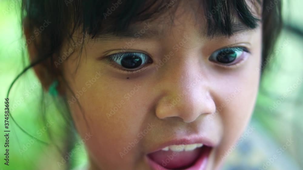 Slow motion of surprised young asia girl with big eyes. Slow motion of surprised young asia girl with big eyes.