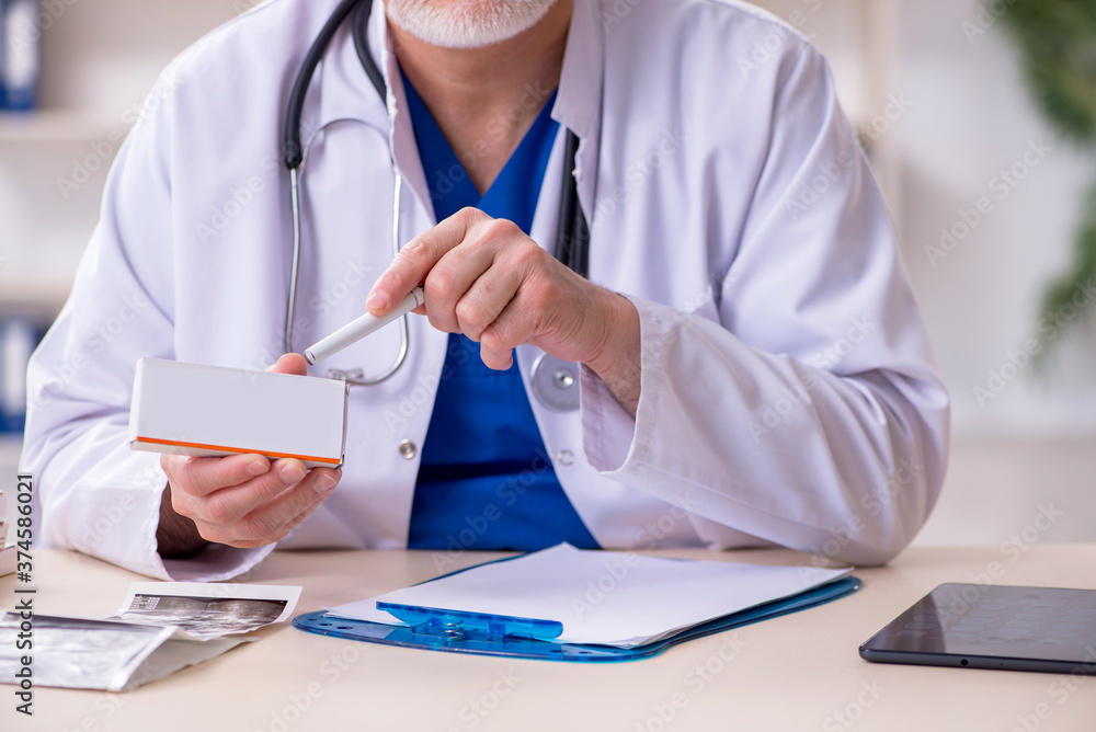 Male experienced doctor working in the clinic Male experienced doctor working in the clinic