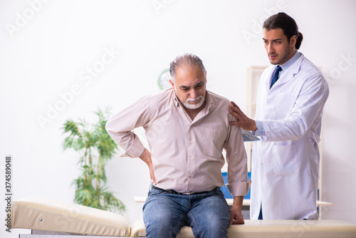 Old patient visiting young male doctor
