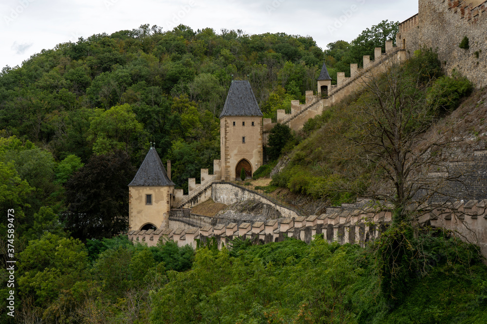 Karlstein is a medieval royal castle, in the Czech forests and countryside during the day Karlstein is a medieval royal castle, in the Czech forests and countryside during the day