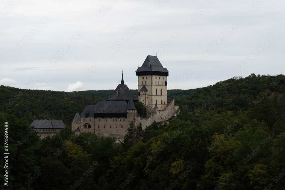 Karlstein is a medieval royal castle, in the Czech forests and countryside during the day Karlstein is a medieval royal castle, in the Czech forests and countryside during the day