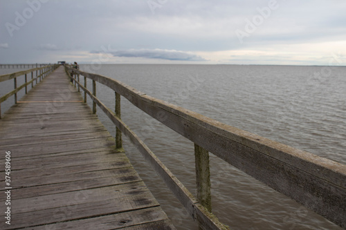wooden pier on the beach © Flavio