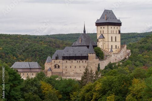  Karlstein is a medieval royal castle, in the Czech forests and countryside during the day