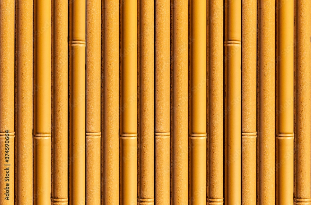 Fototapeta premium Bamboo wall or Bamboo fence texture. Old brown tone natural bamboo fence texture background