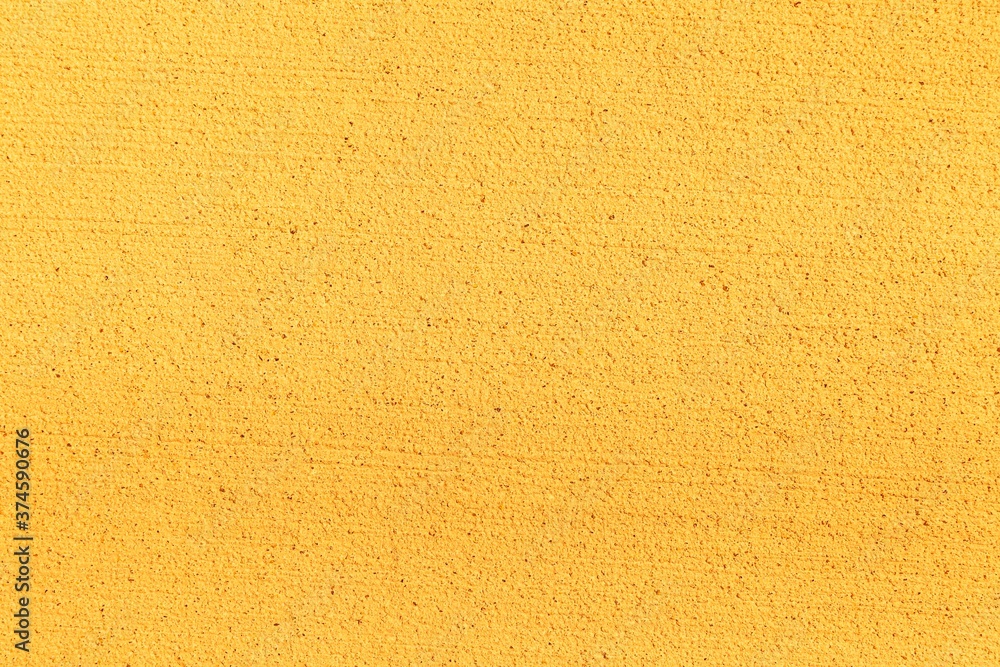 Fototapeta premium Patterned cement wall Vintage yellow painted texture and background
