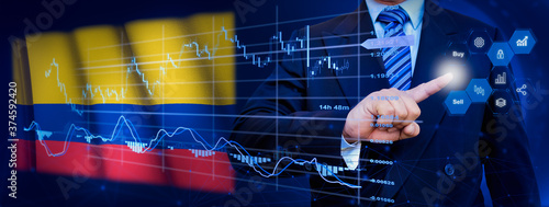 Businessman touching data analytics process system with KPI financial charts, dashboard of stock and marketing on virtual interface. With Colombia flag in background. © TexBr