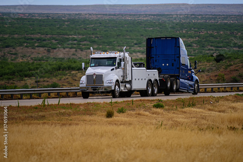 Tracking transports in the USA. Trucks on American roads. Delivery. Truck repair.