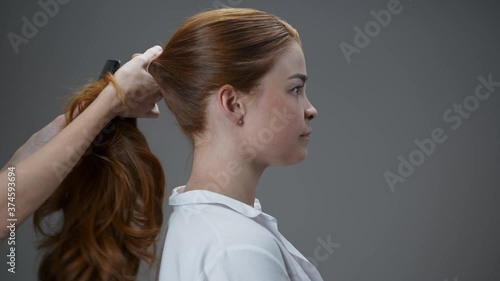 Wallpaper Mural Young red-haired girl combing her hair. Torontodigital.ca