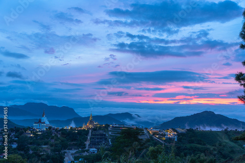 .sunrise above wat Phachonkeaw Khao Kho Phetchabun province Thailand..5 sitting buddha statues on Khao Kho hill the beautiful landmark and famous in Thailand... photo