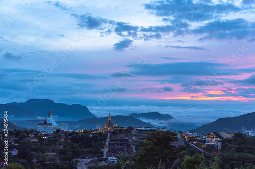 .sunrise above wat Phachonkeaw Khao Kho Phetchabun province Thailand..5 sitting buddha statues on Khao Kho hill the beautiful landmark and famous in Thailand... photo