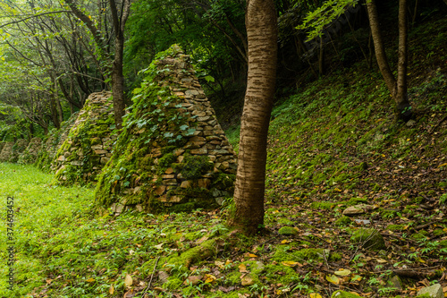 Row of cairns covered with ivy