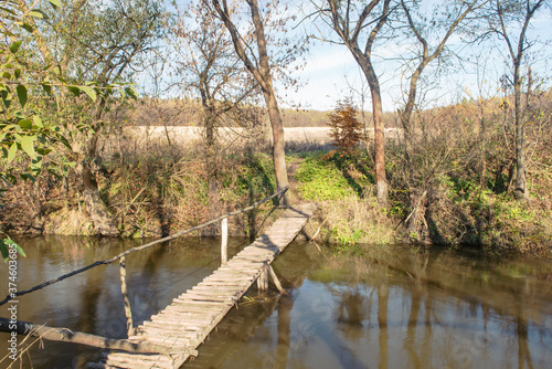 The fast river Zbruch in the autumn forest of the national reserve Tovtry, Khmelnytsky region, Ukraine. photo