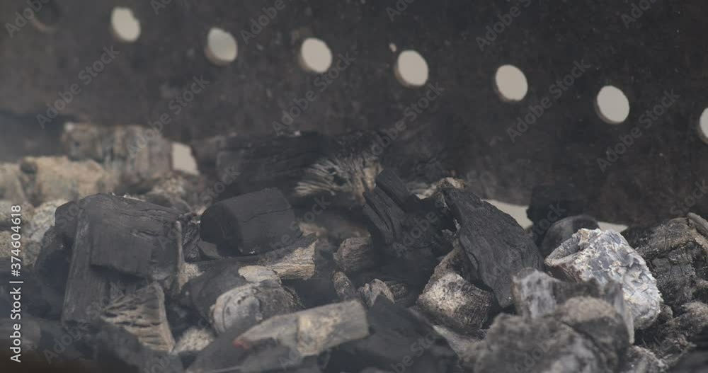 Fireplace with burn ash and smoke, prepared to cook barbecue outside. Slow motion of burning coals into campfire. Fireplace with burn ash and smoke, prepared to cook barbecue outside. Slow motion of burning coals into campfire.