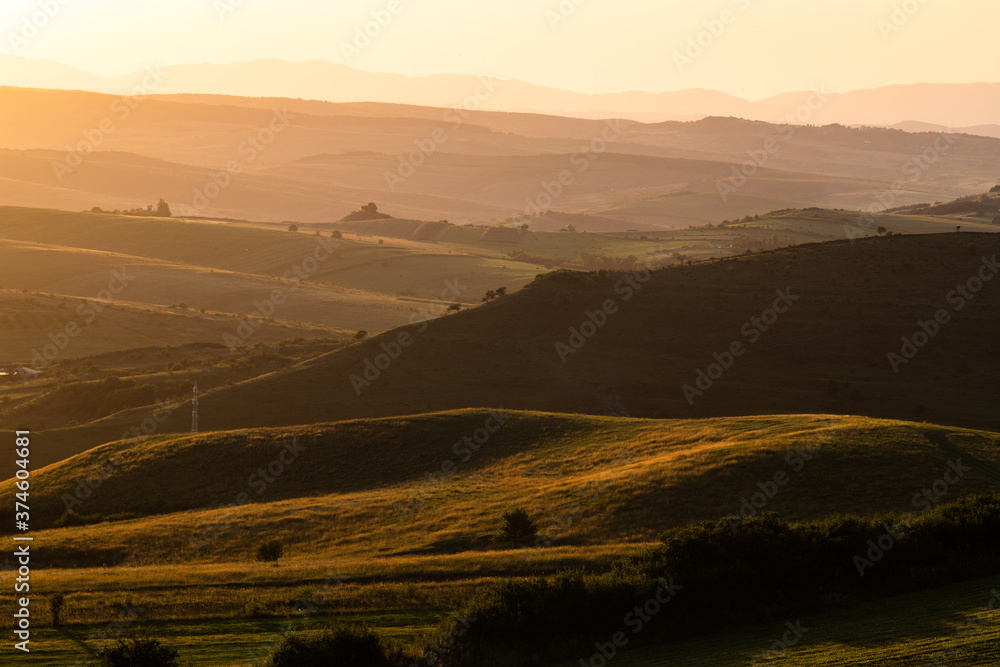 rolling hills in autumn sunset nature background
