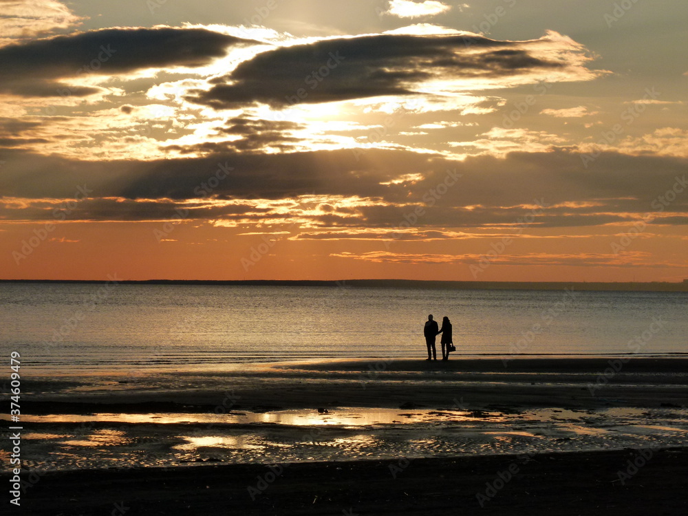 Sunset on the beach of the Sestroretsk resort, coast of the Gulf of Finland, St. Petersburg, Russia.