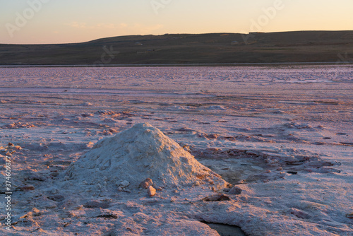 Dried up salt lake at sunrise photo