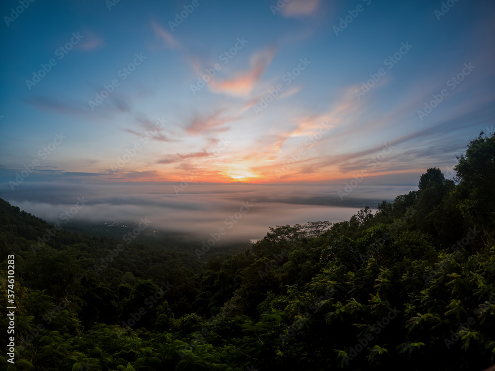 Chiang Mai city in Thailand is covered with mist, the morning sun shines.