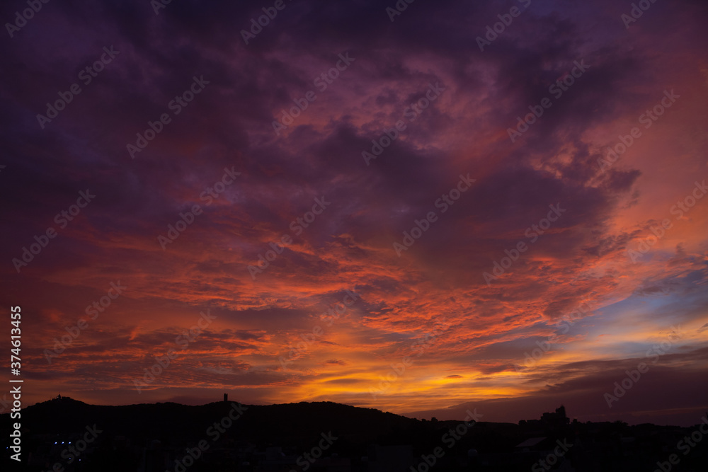 Beautiful clouds above the hill during the sunset Beautiful clouds above the hill during the sunset