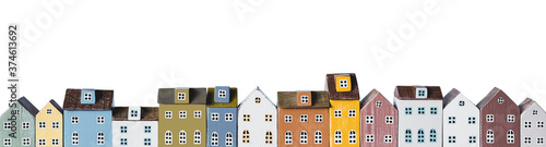Row of miniature colorful retro houses on white background photo