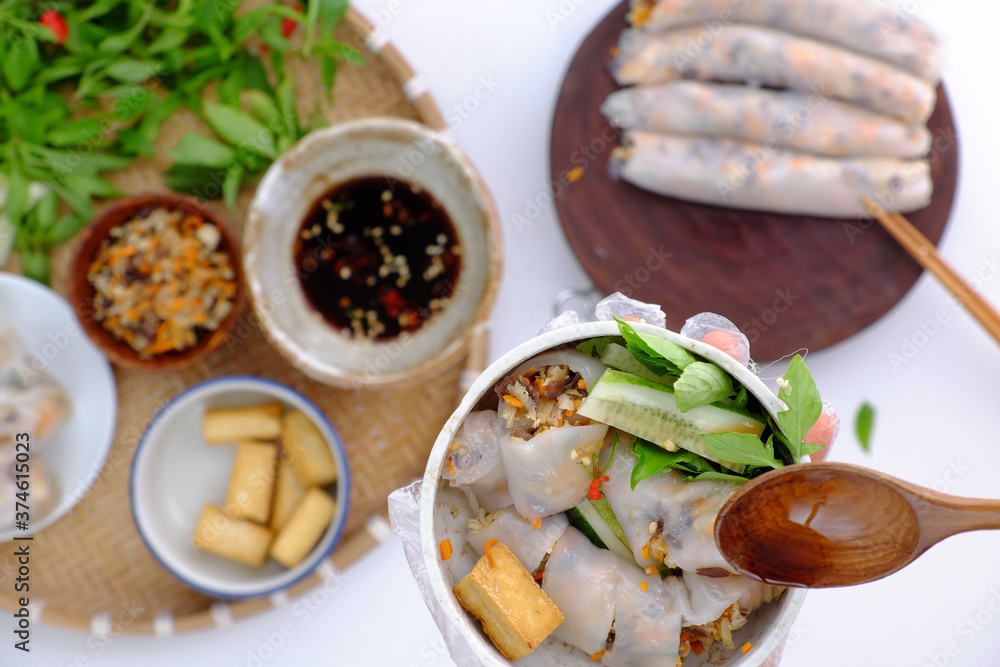 people have breakfast at home with homemade vegan Vietnamese rice noodles roll on food background people have breakfast at home with homemade vegan Vietnamese rice noodles roll on food background