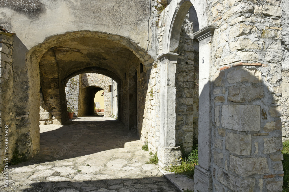 A narrow street among the old houses of Cercemaggiore, a rural village in the Molise region.