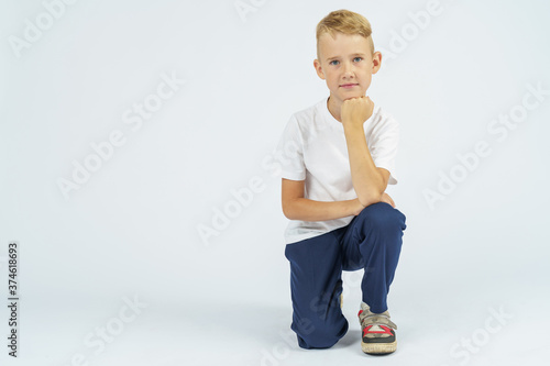 Portrait of a schoolboy looking at the camera. Isolated background.