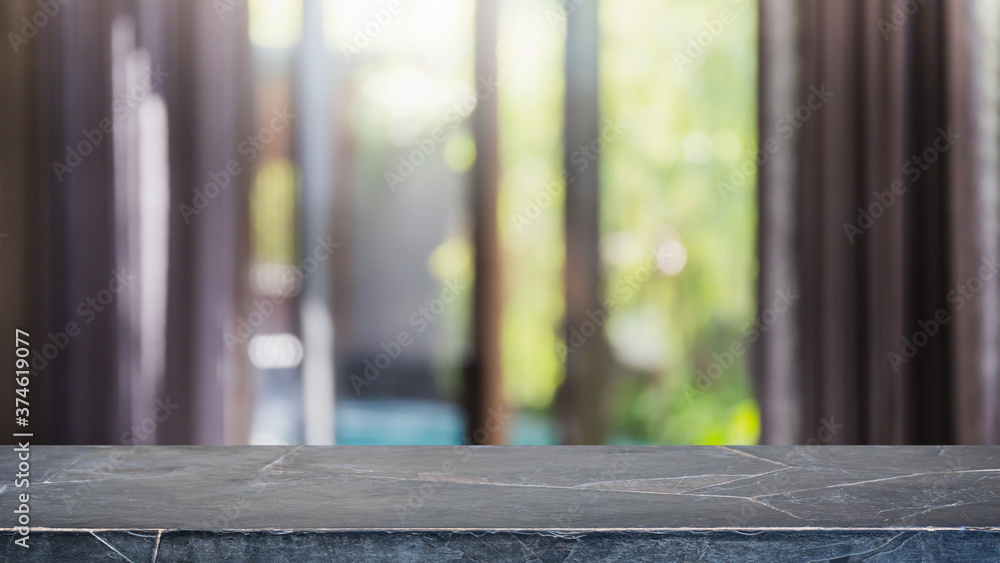 Empty black marble stone table top and blurred home interior with curtain window background. - can used for display or montage your products.