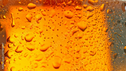 Water drops on glass of bee...