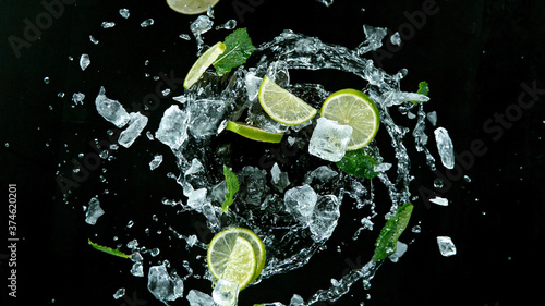 Fresh ripe limes with ice c...