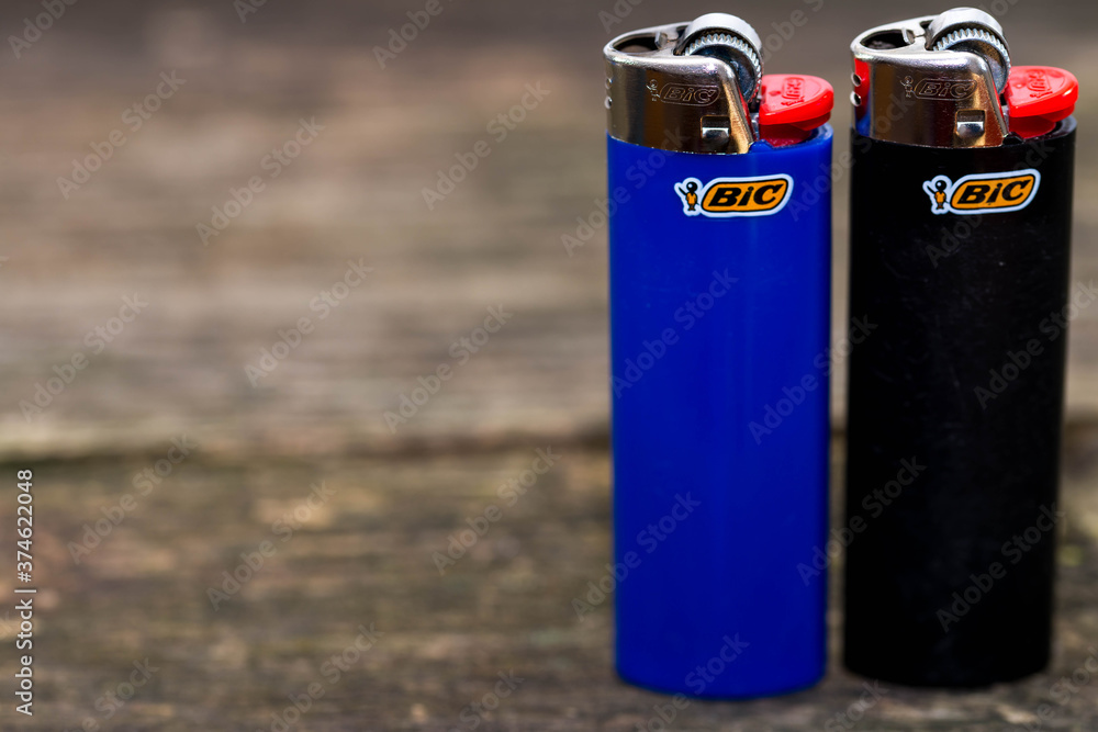 Miercurea Ciuc, Romania- 30 August Two Bic cigarette lighters on aged pine wood boards, space for text. Stock Photo | Adobe Stock