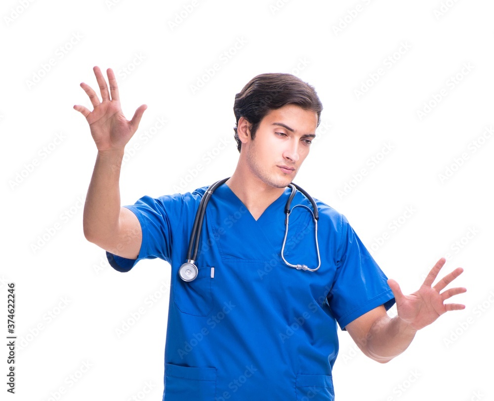 Young male doctor pressing buttons isolated on white Young male doctor pressing buttons isolated on white