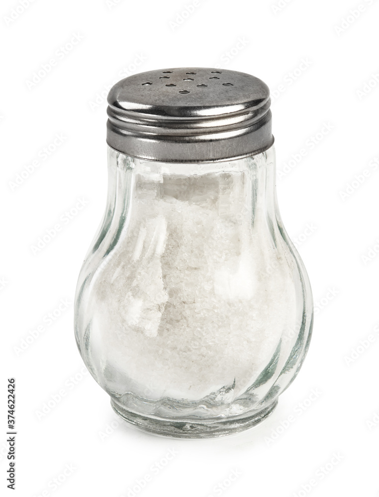 Salt shaker isolated on white background. Salt in glass bottle. Salt shaker isolated on white background. Salt in glass bottle.