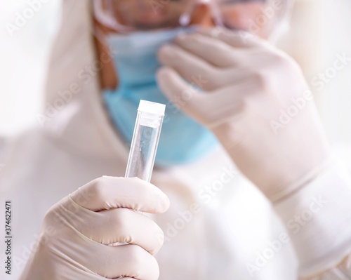 Young chemist student working in lab on chemicals