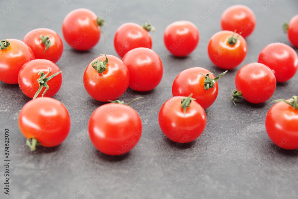 Cherry tomatoes on a black background. Closeup Cherry tomatoes on a black background. Closeup