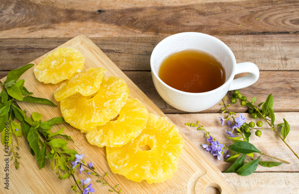 herbal healthy drinks hot tea with pineapple drying dessert snack tasty of lifestyle relax arrangement flat lay style on background wooden herbal healthy drinks hot tea with pineapple drying dessert snack tasty of lifestyle relax arrangement flat lay style on background wooden