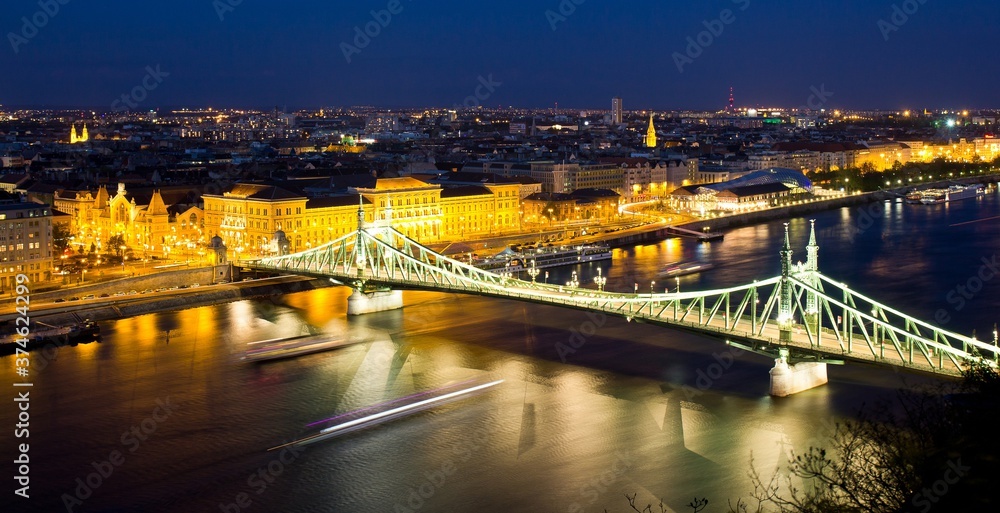 Beautiful view of Liberty Bridge at night. It was built in 1896 and rebuilt in 1945 and connects Buda and Pest across the River Danube. Budapest, Hungary.