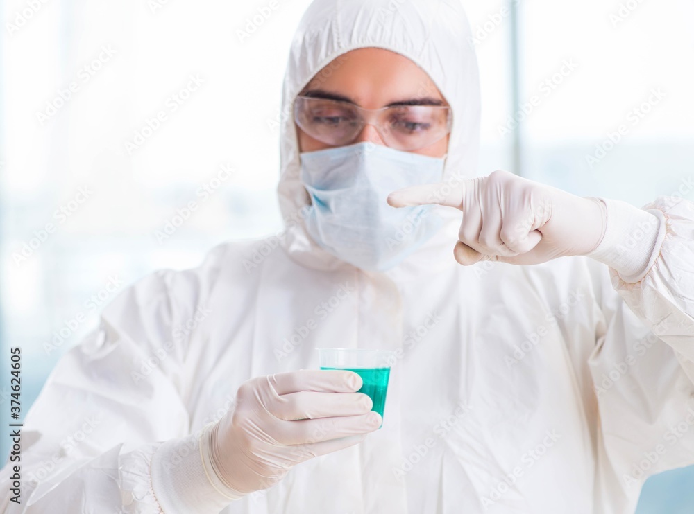 Young chemist student working in lab on chemicals Young chemist student working in lab on chemicals