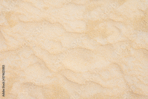 Sand texture as background in summer sun